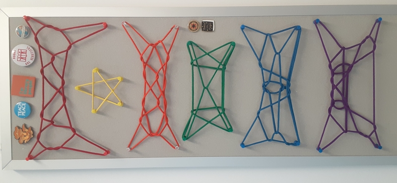 several string figures displayed