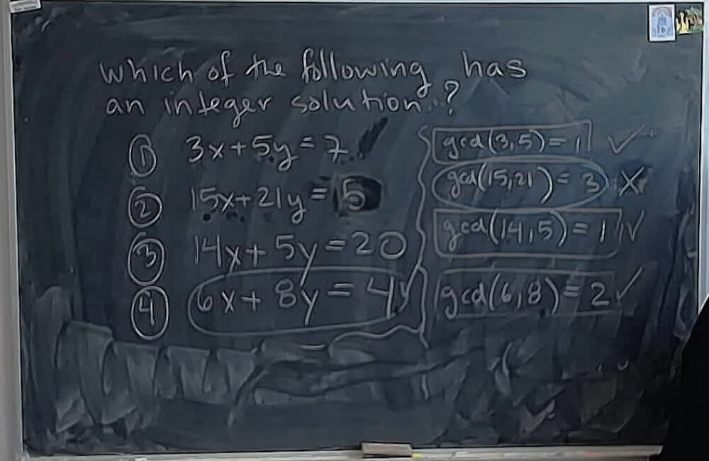 A photo of a whiteboard titled: A02 MCQ: Which Diophantine Equation Has a Solution? (Solution)