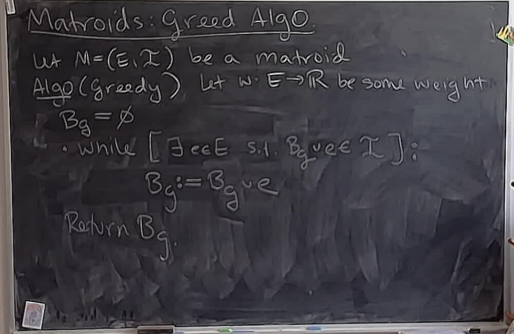 A photo of a whiteboard titled: Matroids: Greedy Algorithm (Part 1)