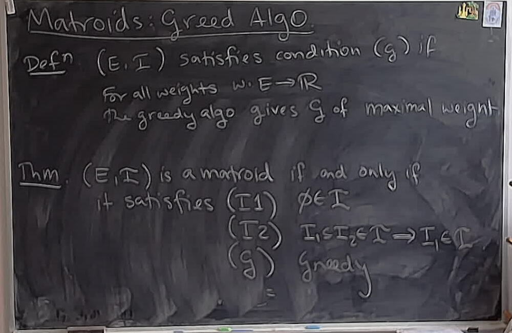 A photo of a whiteboard titled: Matroids: Greedy Algorithm (Part 3)