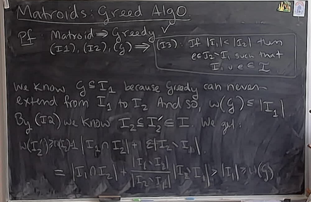 A photo of a whiteboard titled: Matroids: Greedy Algorithm (Part 5)