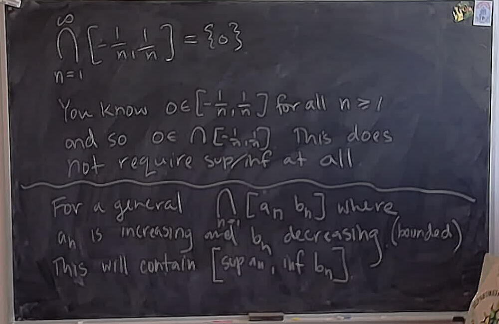 A photo of a whiteboard titled: Nested closed intervals and infs and sups.